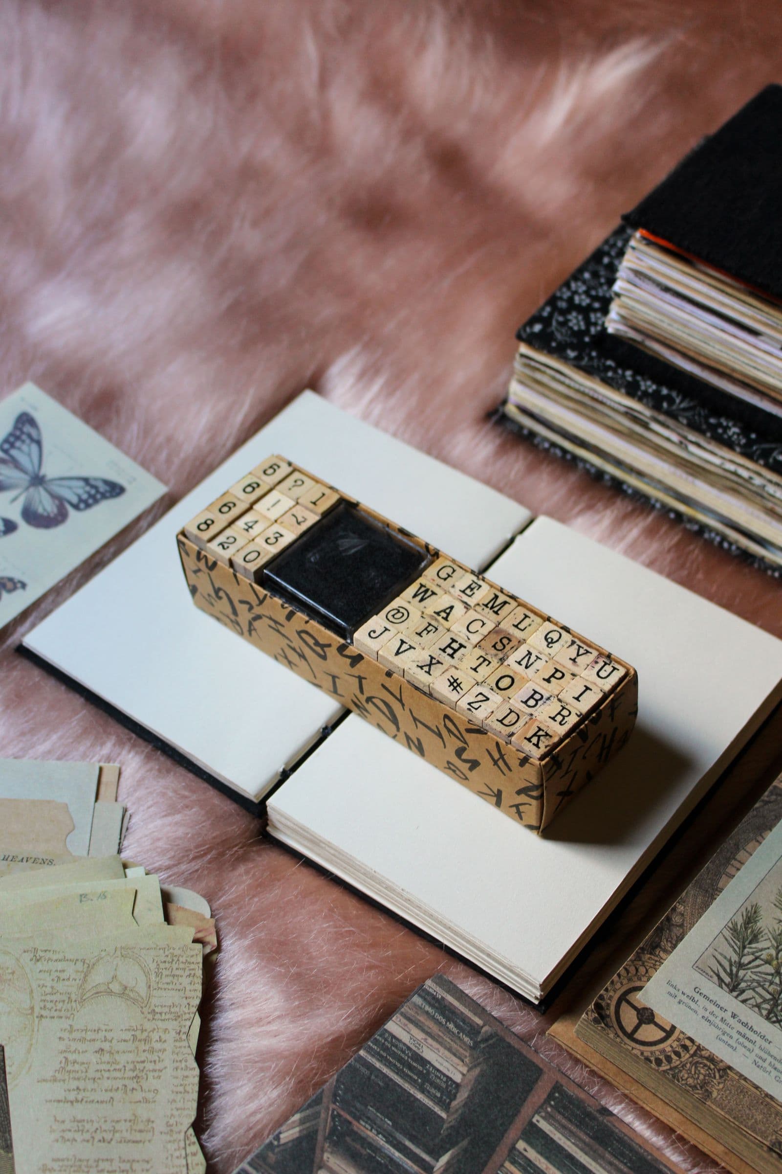A flat lay of journals and stamping supplies